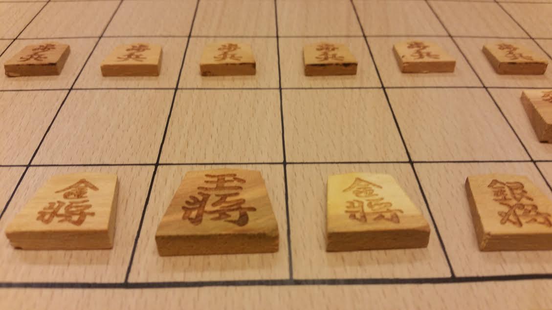Kleine houten shogi stukken